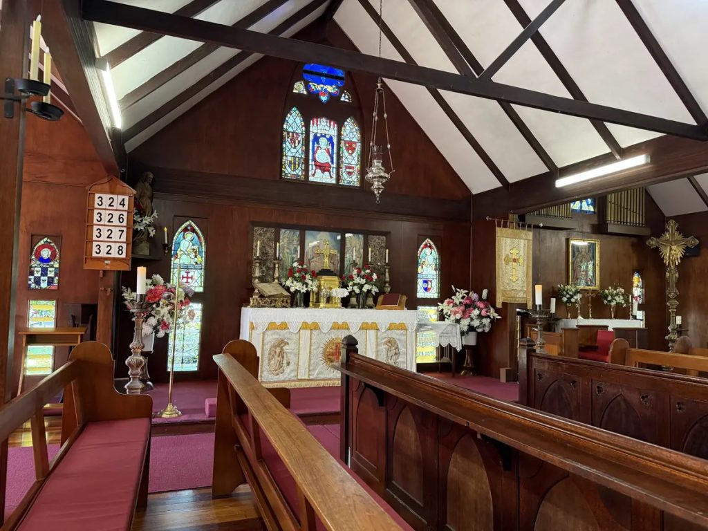 Altar and stained glass windows inside The Abbey Church