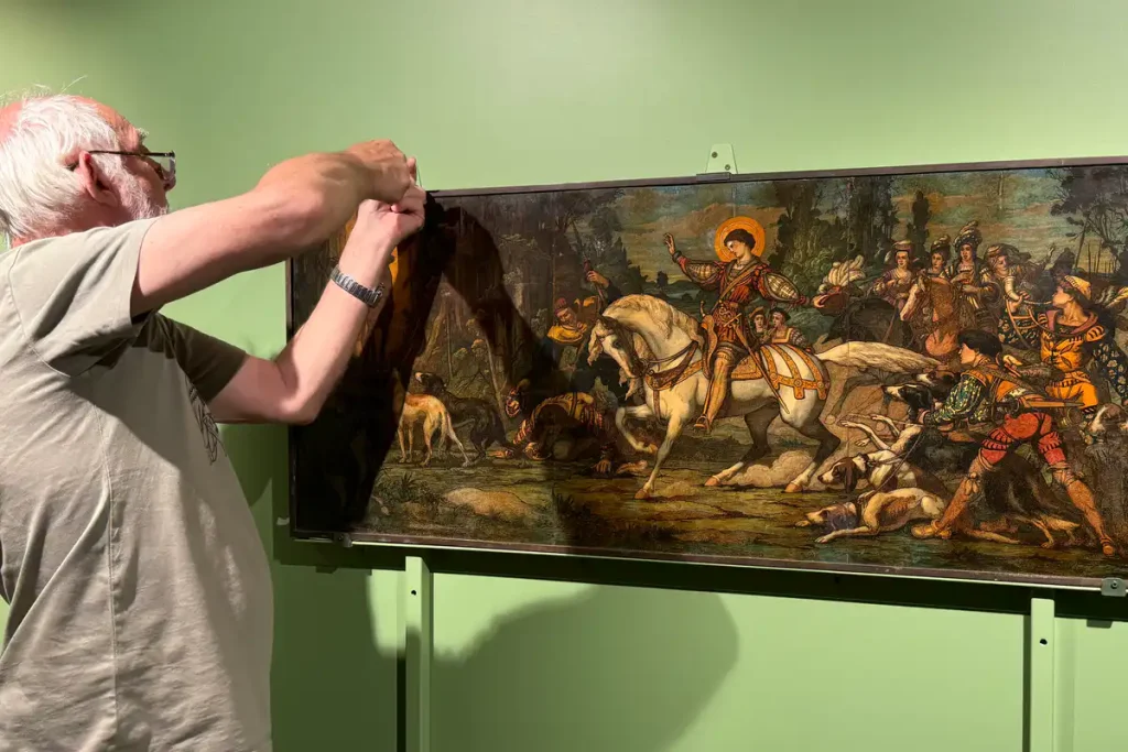 hanging-a-painting-in-the-abbey-museum-art-gallery A painting from The Abbey Church being hung in the Abbey Museum Art Gallery