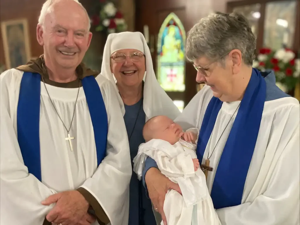 Infant baptism celebration inside The Abbey Church